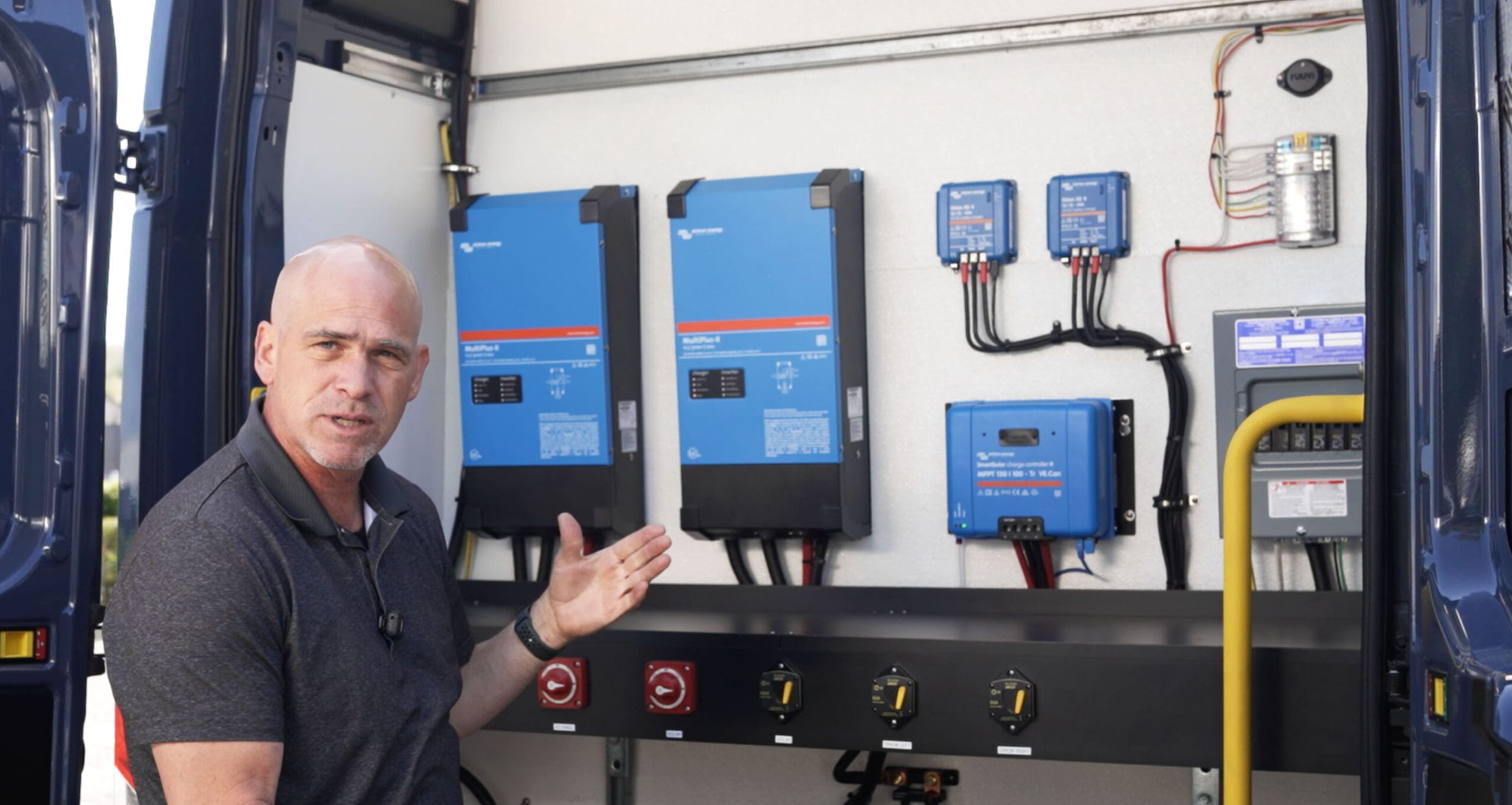 Adam Blair presenting a vehicle-mounted Victron electrical installation